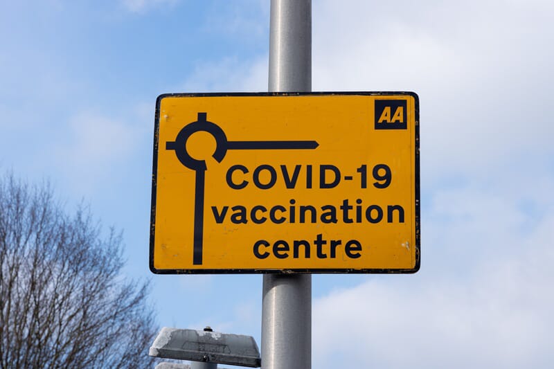 An image of an outdoor sign for a COVID vaccination centre.
